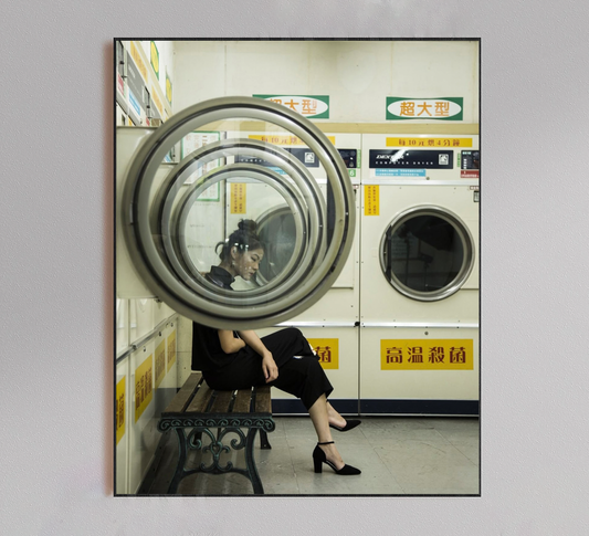 Woman Sitting in Laundromat Poster