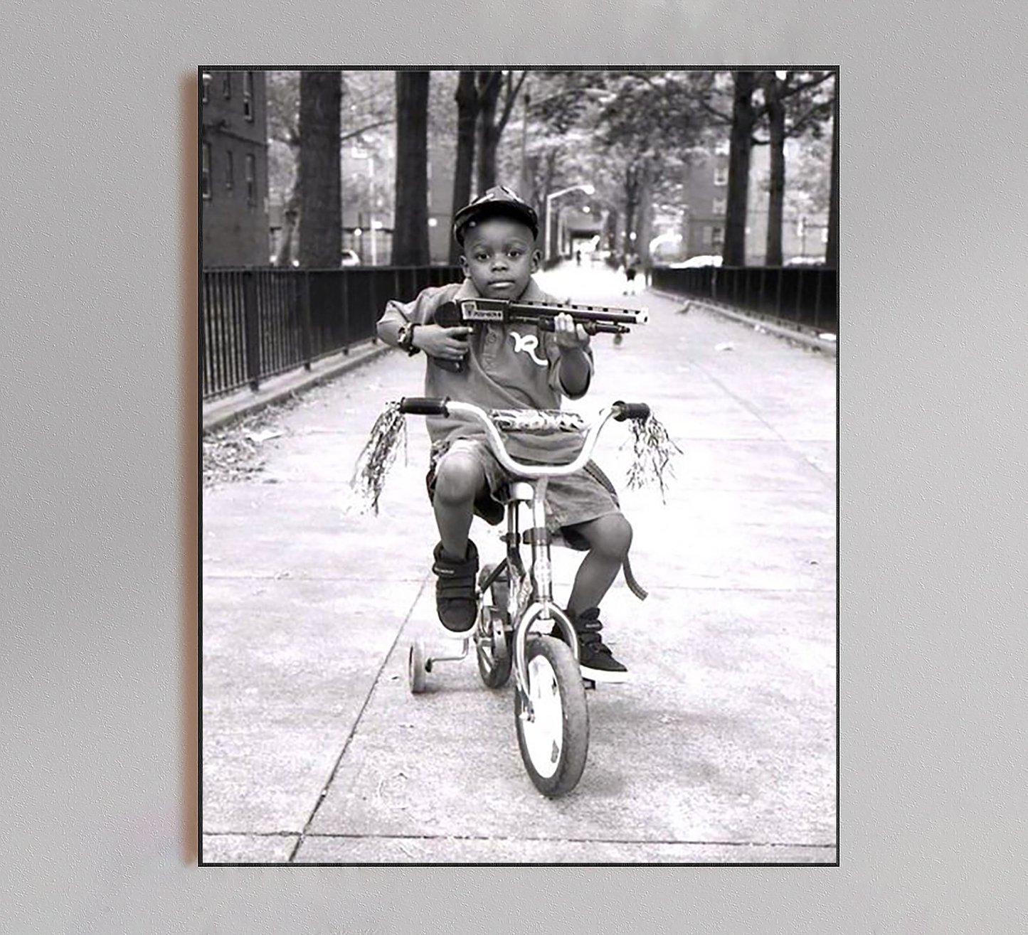 Kid Riding Bicycle with Shotgun Poster