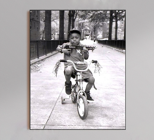 Kid Riding Bicycle with Shotgun Poster
