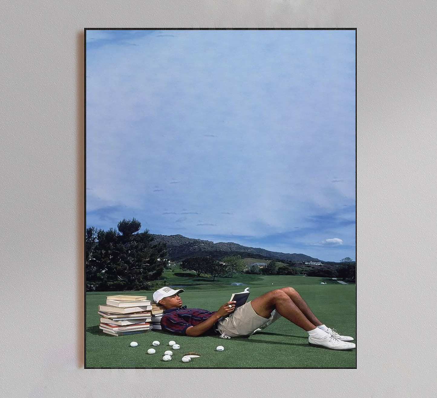 Tiger Woods Reading Book on Golf Course Poster