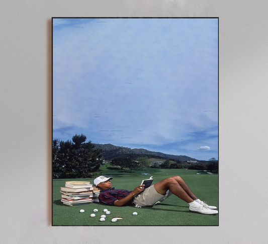 Tiger Woods Reading Book on Golf Course Poster
